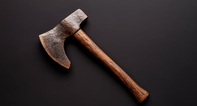 Vintage rustic axe on black background photo
