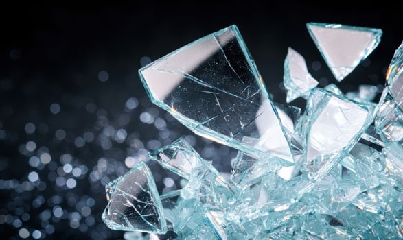 Shattered glass crystals on dark background photo