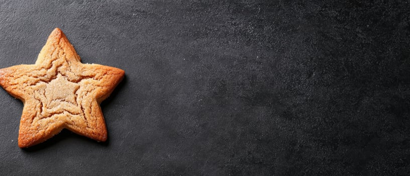 Homemade star shaped cookie on dark background photo