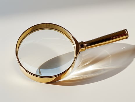 Magnifying glass on light background photo