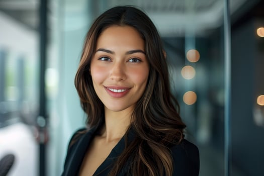 Smiling young woman with long dark hair photo