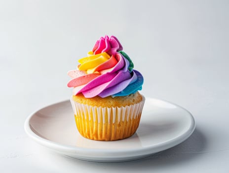 colorful cupcake with rainbow frosting photo
