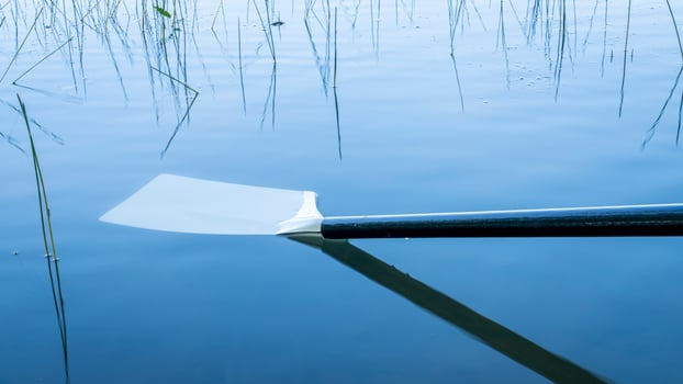hatchet sculling oar on a calm lake, Boyd Lake in Colorado photo