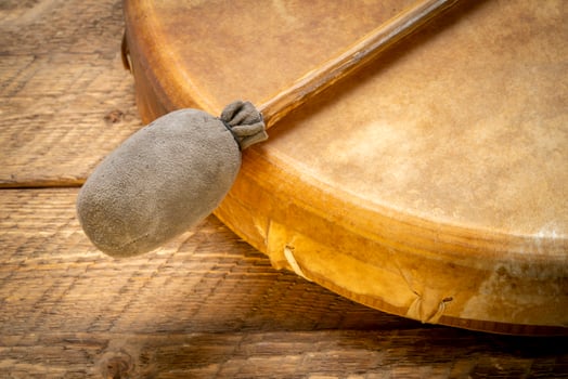 handmade, native American style, shaman frame drum covered by goat skin with a beater or a rustic wood photo