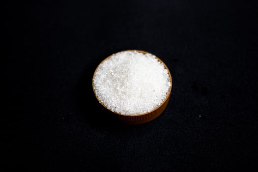 The stop sugar sign warns that too much sugar will lead to unhealthy eating patterns, obesity, diabetes, dental care and much more. photo