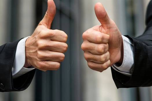 Businessman showing thumbs up gesture photo