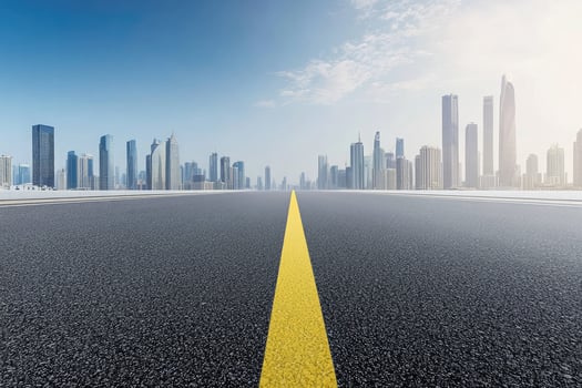 Asphalt Road Leading to Modern City Skyline Urban Landscape photo