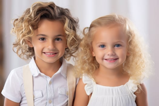 Smiling siblings with curly hair photo