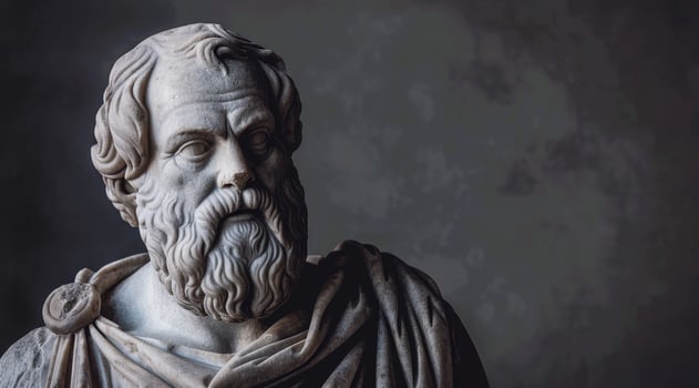 Ancient Greek Philosopher Statue with Dramatic Lighting photo
