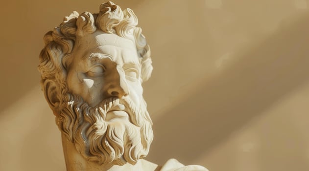 Classical sculpture of a bearded man with dramatic lighting photo