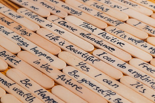 Positive thoughts for increasing selfesteem on wooden posts on wooden background photo