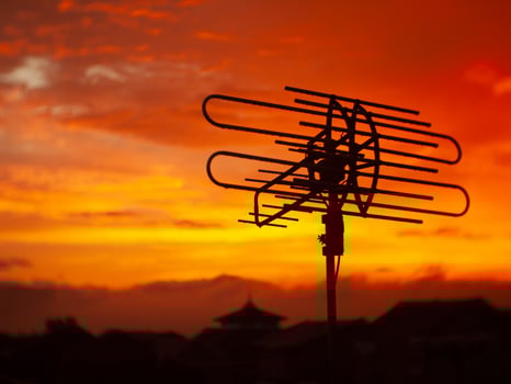 Antenna Silhouette Against a Bright Sunset. photo