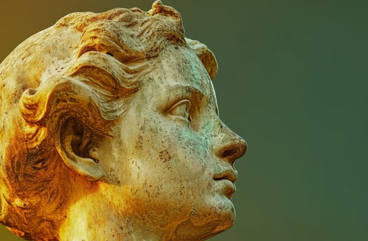 Close up of an Ancient Sculptures Face with Artistic Lighting photo