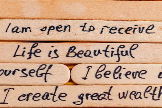 Positive thoughts for increasing selfesteem on wooden posts on wooden background photo