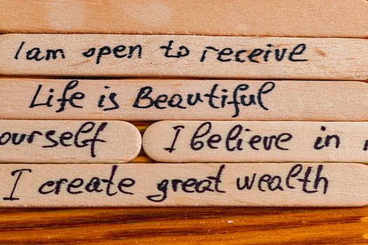 Positive thoughts for increasing selfesteem on wooden posts on wooden background photo