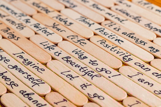 Positive thoughts for increasing selfesteem on wooden posts on wooden background photo
