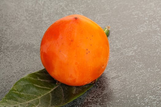 Fresh ripe sweet juicy persimmon photo