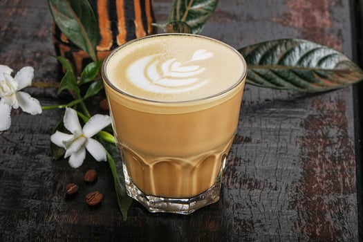 Hot cappuccino coffee in the glass photo