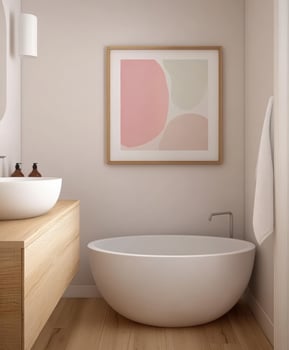 Modern bathroom design featuring a freestanding tub and artwork photo