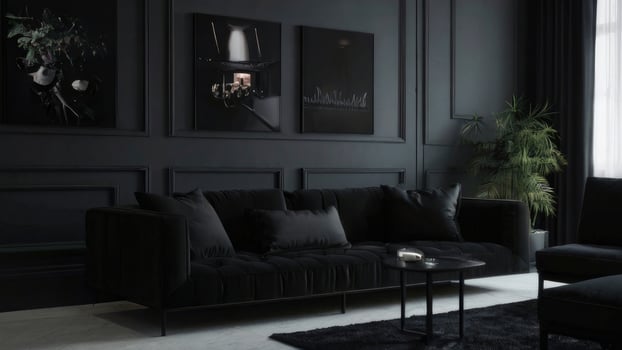 Dark Modern Living Room Decor With Black Sofa And Artwork photo
