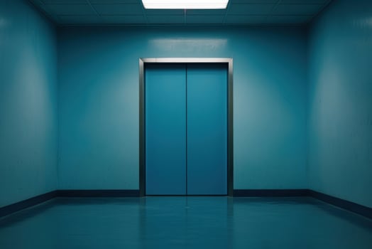 A modern elevator in a turquoise hallway, minimalistic design. photo