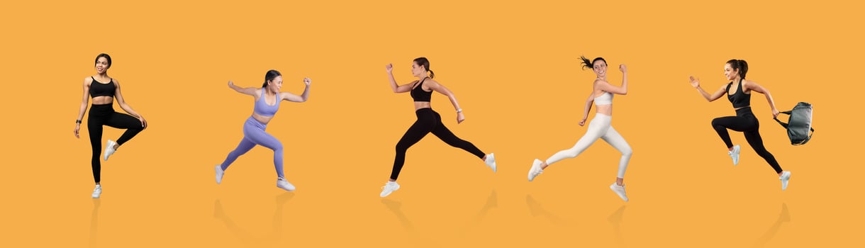 Five athletic women in various outfits demonstrate energetic running and exercising against a vibrant orange backdrop, showcasing fitness and movement in action during daylight. photo