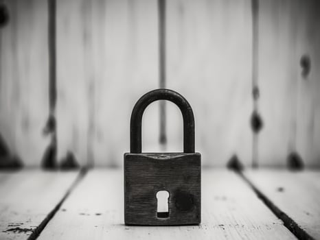 Wooden Padlock with Keyhole on Light Wooden Background. photo
