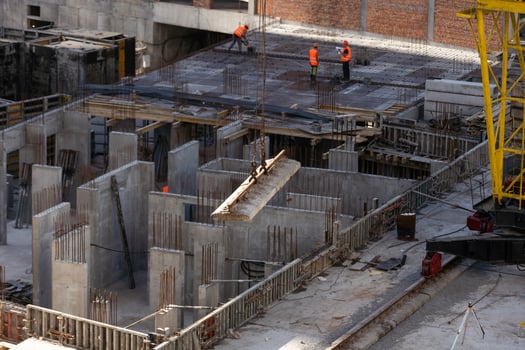 Concrete drainage pipes at the construction site. Laying of underground storm sewer pipes. Installation of water main, sanitary sewer. Installation of concrete sewer wells in the ground photo