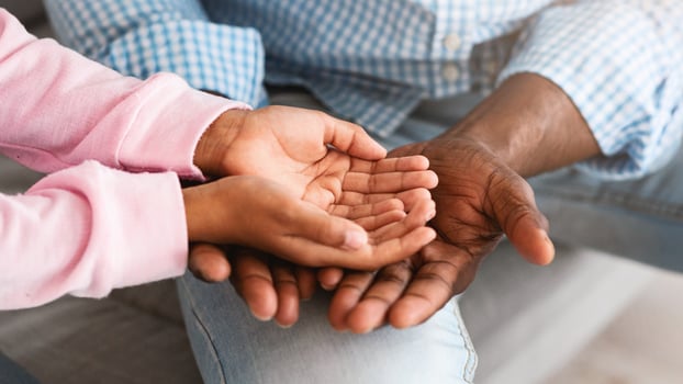 Family bonding time. Closeup view of unrecognizable grandfather and grandchild holding hands together. Panorama photo