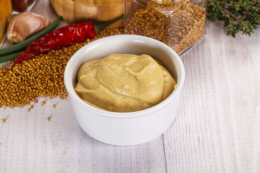 Dijon mustard sauce in the bowl photo
