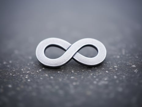 Infinity symbol on a textured surface photo