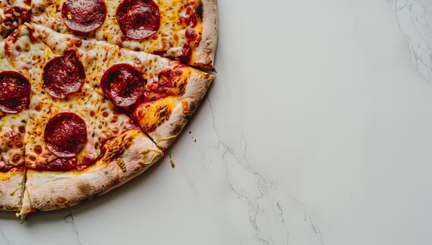 Delicious pepperoni pizza on a marble background photo