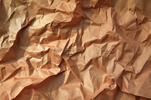 Close up of crumpled brown paper texture photo