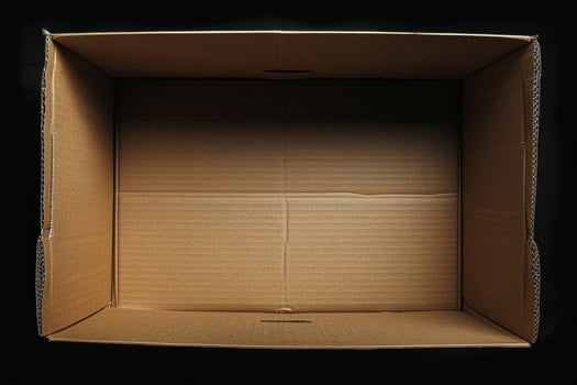 Empty cardboard box on a black background photo