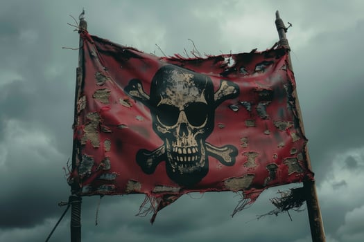 Tattered pirate flag waving under stormy skies photo