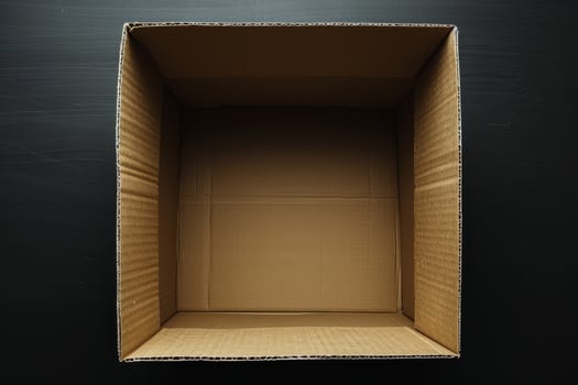 Empty cardboard box on a black background photo