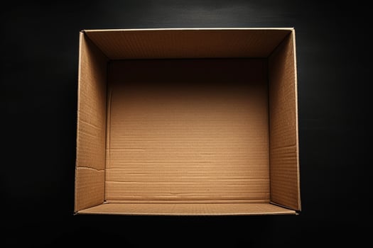 Open empty cardboard box on a black background photo