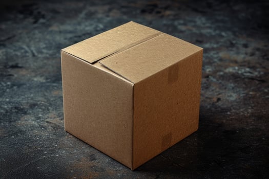 Cardboard box on a textured surface photo
