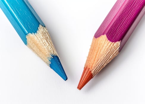 Two colored pencils on a white background photo