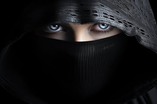 a woman wearing a black scarf and a black head covering photo