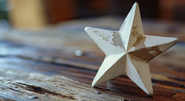 a white star on a wood surface photo