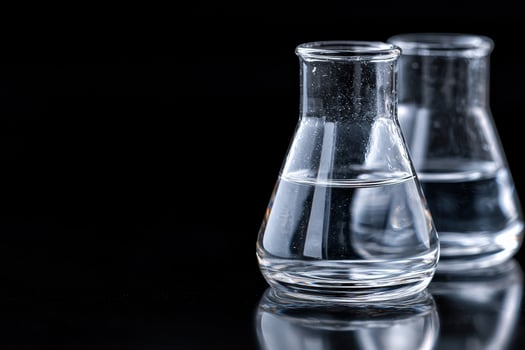 scientific glassware on a dark background photo