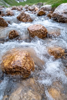 Flowing stream with rocky landscape photo