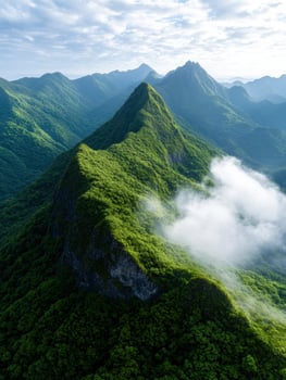Lush green mountains and clouds in the distance photo