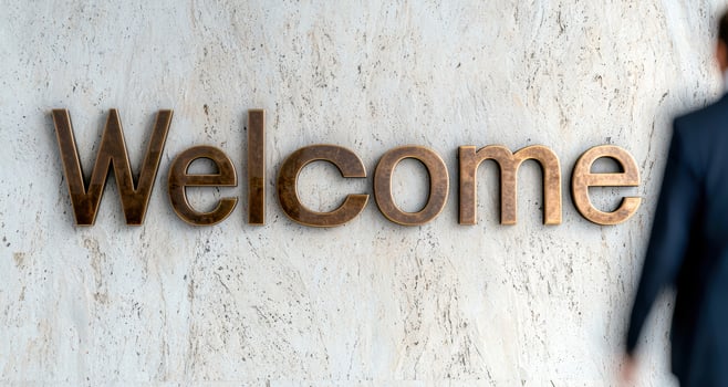 welcome sign on concrete wall photo