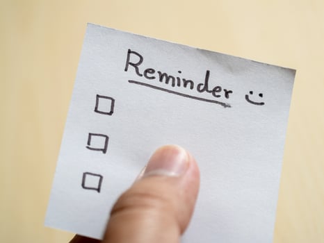 Productivity tips reminder note home office visual aid organized environment close-up motivation photo