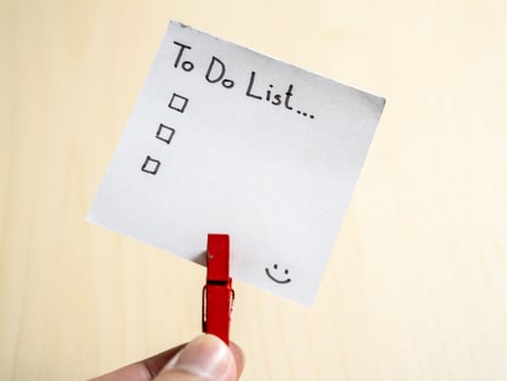 Organizing your day to-do list essentials home office note minimalist close-up productivity tips photo