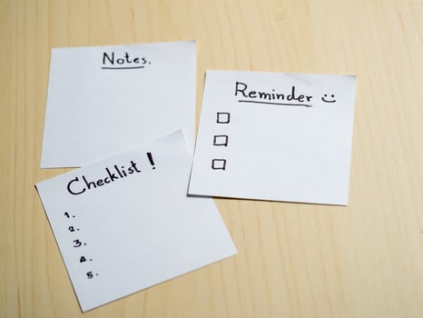 Organizing your life checklist notes and reminders on a wooden table home office conceptual view photo