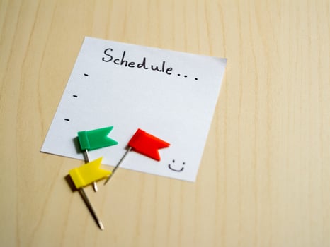 Organizing your daily schedule with colorful flags at home office workspace photo