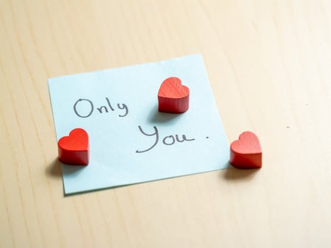 Romantic gesture with hearts home greeting card intimate setting close-up love concept photo